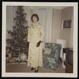 [Standing by the Christmas tree, location unknown]
