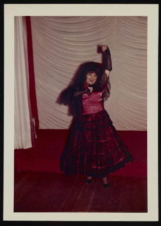 [Audrey in a black and red skirt posing in front of the stage, Chevalier d'Eon, Hunter, NY]

