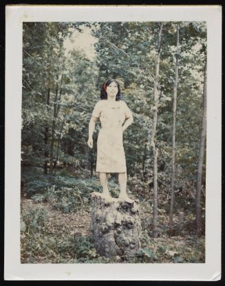 [Lili posing on a tree trunk, Hunter, NY]
