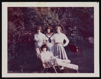 [Susanna sitting on a lawn chair with Daphne and two friends, Casa Susanna, Hunter, NY]
