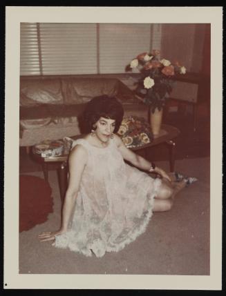 [Susanna in a white negligee sitting on the floor, New York City apartment]
