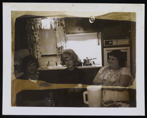 [Jody and two friends in the kitchen, location unknown]

