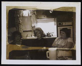 [Jody and two friends in the kitchen, location unknown]
