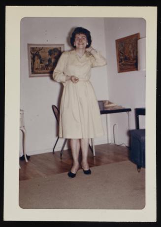 [Edith in a cream dress, location unknown]
