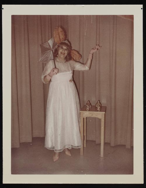 [Posing with an umbrella, location unknown]
