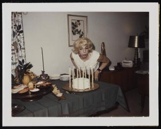 [Susanna and friends blowing out candles, location unknown]

