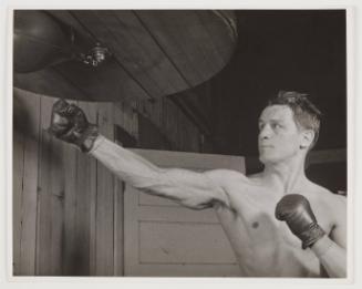 man hitting punching bag