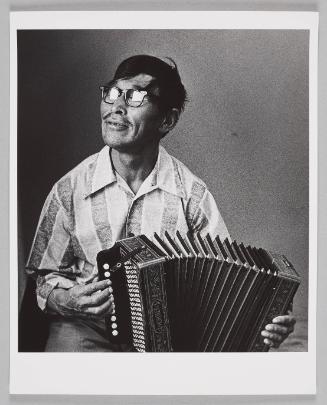 Joannie Saituk playing accordian
