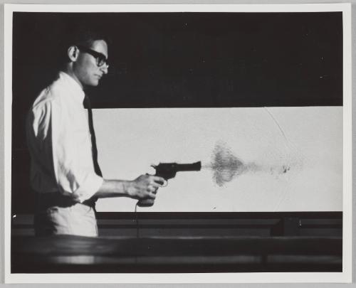 man firing gun