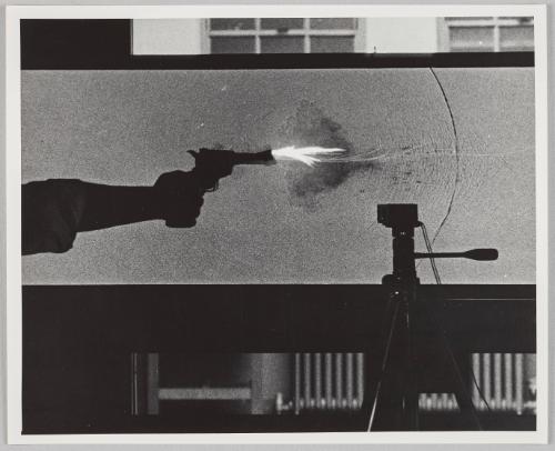 a pistol firing