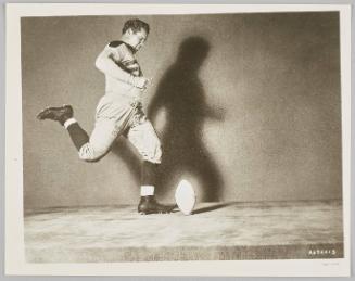 Tex Harris kicking the football, MGM, 1940