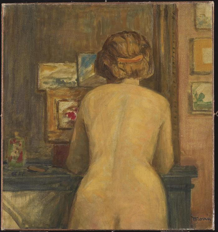 Nude from behind by the fireplace
